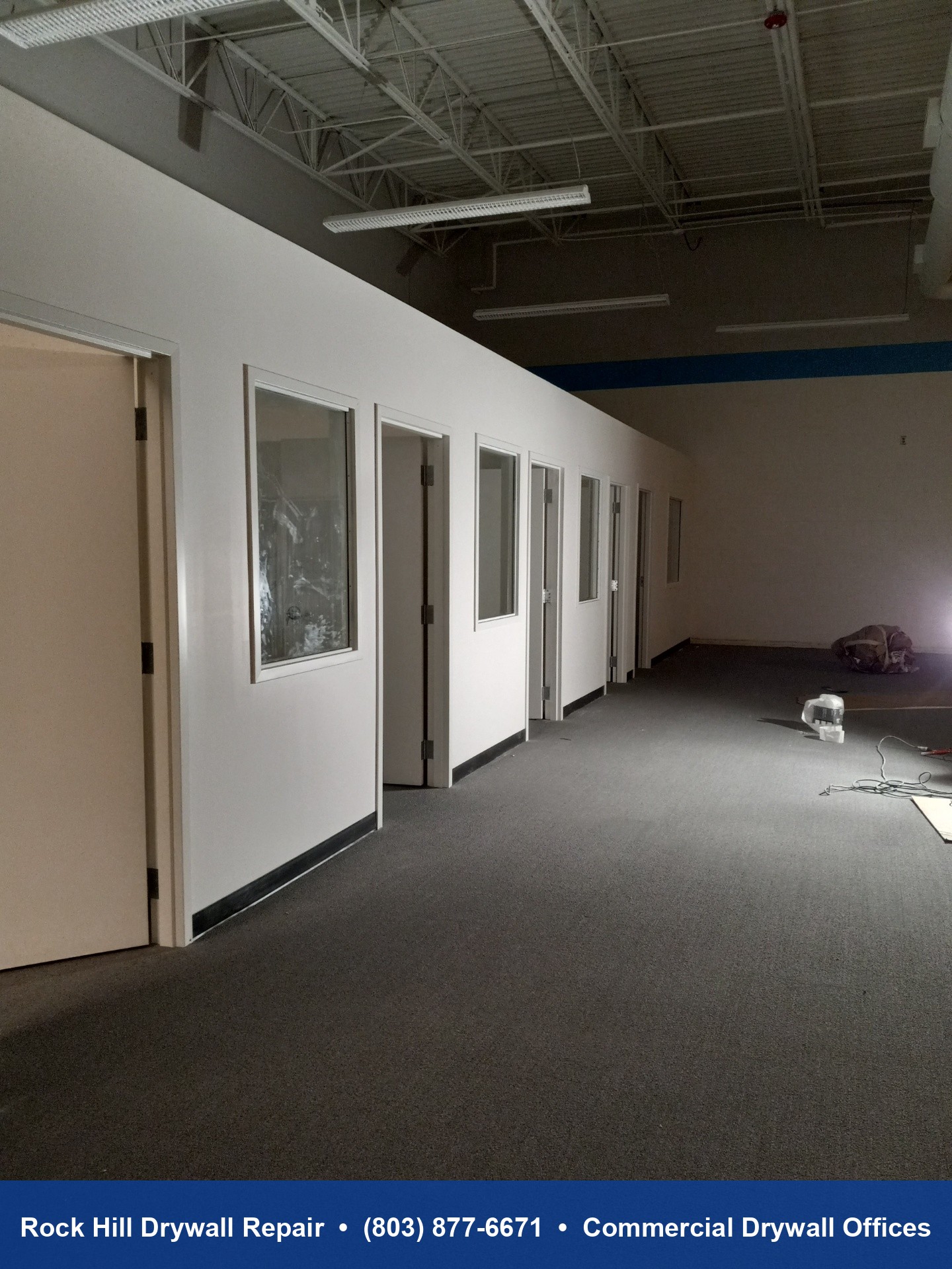 Hallway view of completed commercial drywall office buildout in Rock Hill SC warehouse