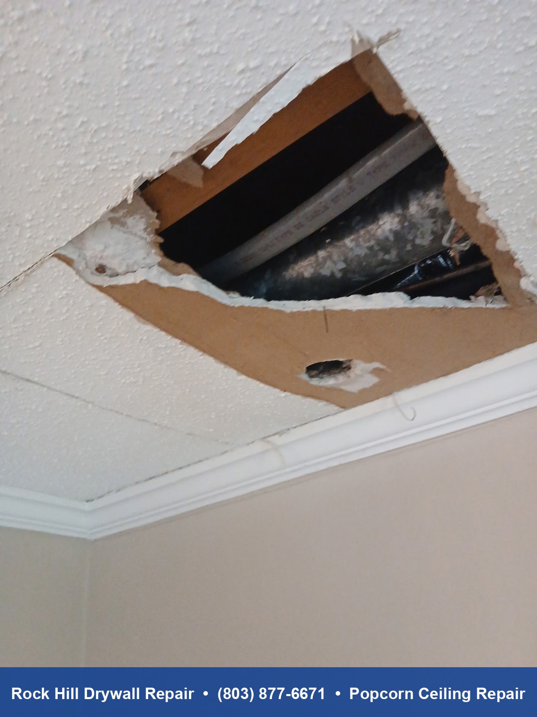 Popcorn ceiling with hole showing exposed joists before drywall repair in Rock Hill SC