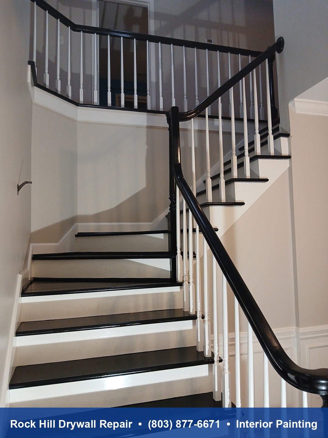 Completed staircase painting with black treads and white risers and banister in Rock Hill SC home